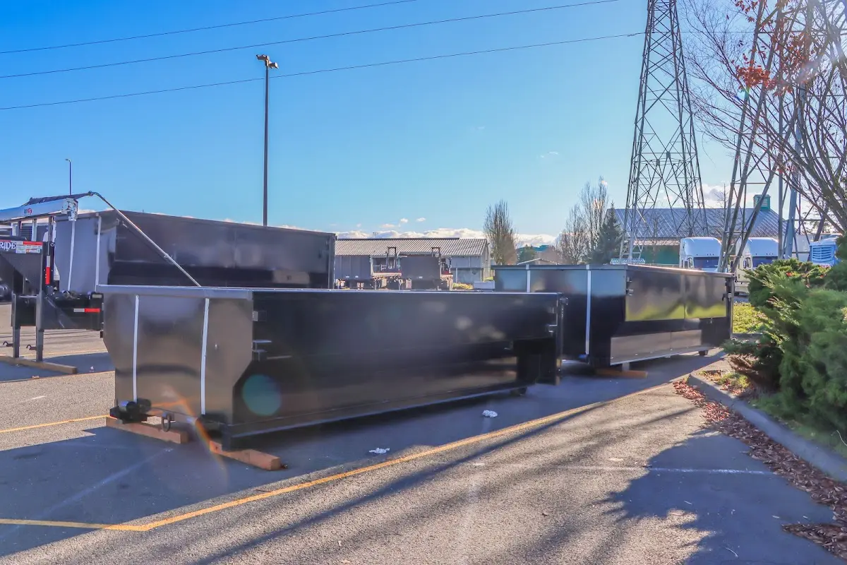 Roll-off dumpster ready for waste disposal at job site for 15 Yard Dumpster Rental in Grand Haven